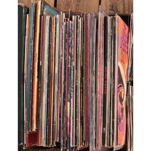 189 - A box of LP and single records. Including Beatles, David Bowie, Elvis, Blondie, Iron Maiden, etc.