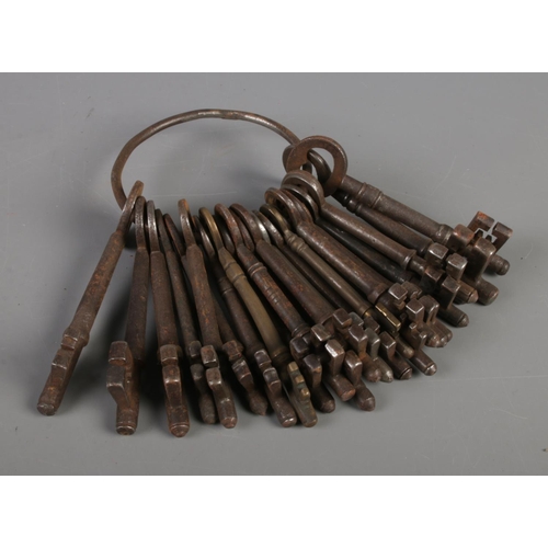 32 - A metal ring of antique keys. Approximately 24.