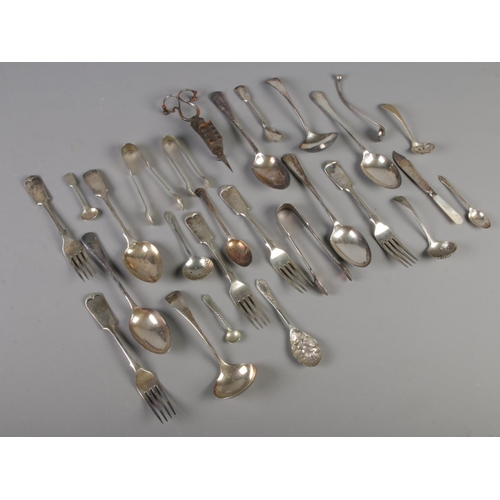 34 - A quantity of silver plate flatware. Including ladles, sugar tongs, basting spoons, berry spoons, et... 