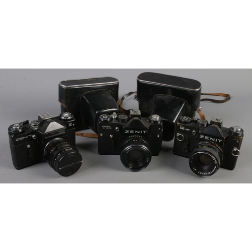 37 - Three Zenit SLR cameras. Includes Zenit 12XP, Zenit TTL and Zenit E. Two with carry cases.