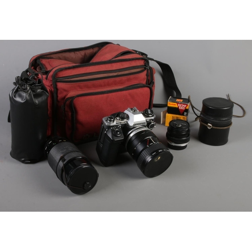 41 - An Olympus OM10 SLR camera. With Olympus camera bag and equipment.