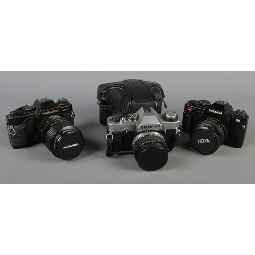 43 - Two Miranda SLR cameras along with a Olympus OM20 SLR camera.