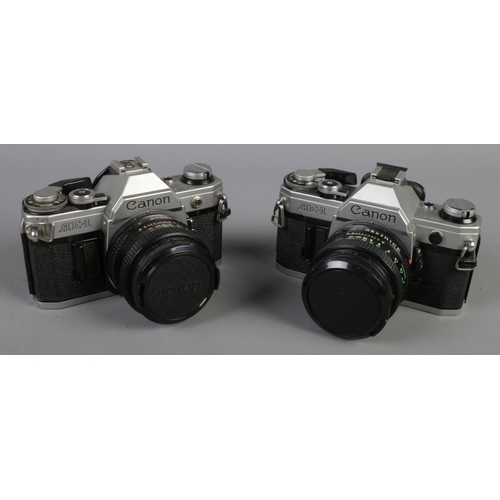 5 - Two Canon AE-1 SLR cameras. Both with Canon 50mm 1:1.8 lens.