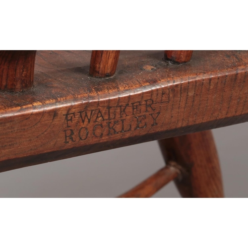 127 - A 19th century ash/elm Windsor arm chair with crinoline stretcher and pierced slat. Maker's mark for... 