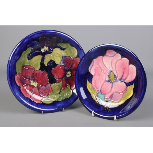 18 - Two Moorcroft pottery dishes. The larger decorated in the Clematis design, 22cm diameter, the smalle... 