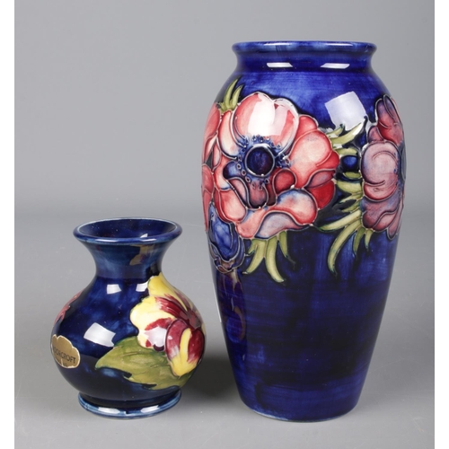 22 - Two Moorcroft pottery vases. Includes larger vase decorated in the Anemone design 19cm, and a squat ... 