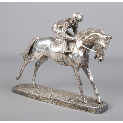 38 - A silver filled model of a horse and jockey. Assayed Sheffield 1999 by Camelot Silverware Ltd. Heigh... 