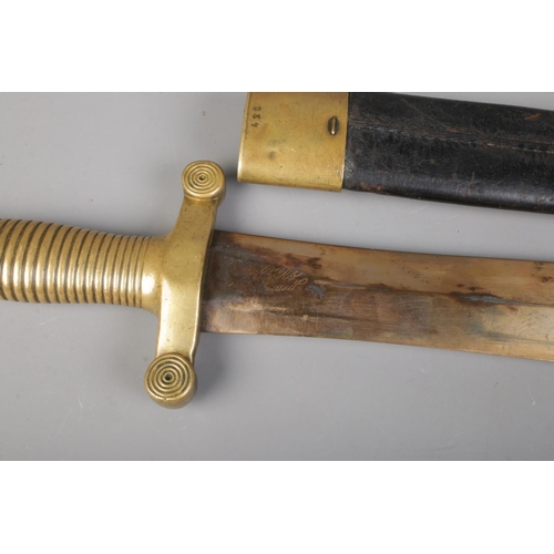 55 - A French 1831 model short sword with brass and leather scabbard. Bearing anchor mark to cross guard,... 