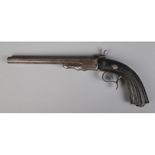 57 - A Continental percussion cap target/duelling pistol, possibly Belgian. With fluted grip and 25cm oct... 