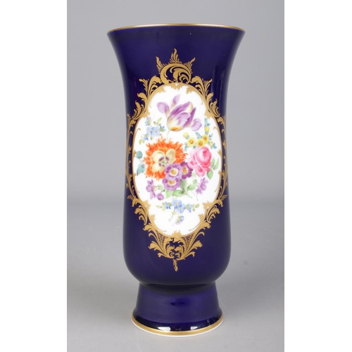 6 - A 20th century Meissen vase with dark blue glaze, gilt borders and a hand painted panel depicting fl... 