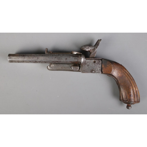 60 - A 19th century Continental double barrel percussion cap pistol. Length 21cm. CANNOT POST OVERSEAS