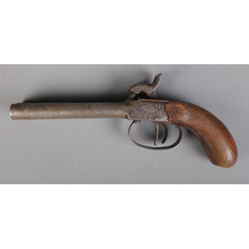 61 - A 19th century double barrel percussion cap pistol. Length 21.5cm. CANNOT POST OVERSEAS