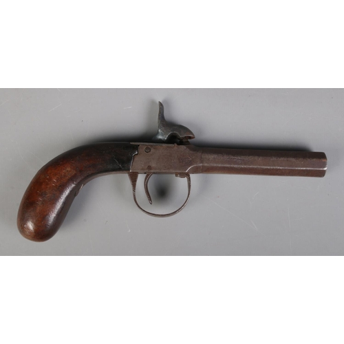 62 - A 19th century percussion cap pistol. Length 19cm. CANNOT POST OVERSEAS