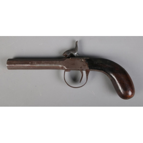 62 - A 19th century percussion cap pistol. Length 19cm. CANNOT POST OVERSEAS