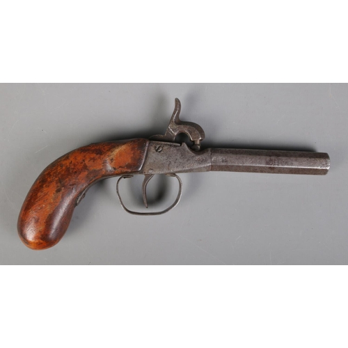 65 - A 19th century percussion cap pistol with octagonal barrel. Length 19.5cm. CANNOT POST OVERSEAS