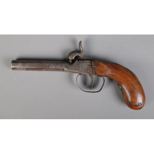 65 - A 19th century percussion cap pistol with octagonal barrel. Length 19.5cm. CANNOT POST OVERSEAS