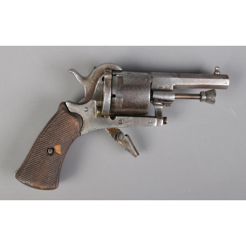 68 - A late 19th century Belgian pin fire revolver. Marked ELG to cylinder and bearing crowned R proof ma... 