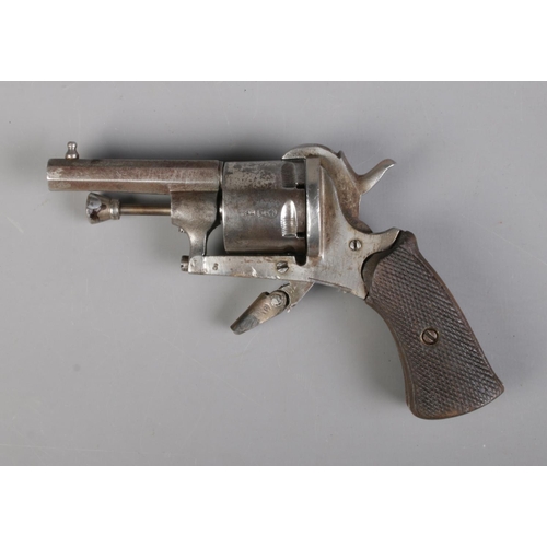 68 - A late 19th century Belgian pin fire revolver. Marked ELG to cylinder and bearing crowned R proof ma... 