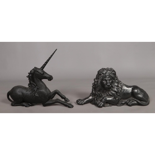 75 - A pair of cast iron models of a lion and unicorn. Possibly formerly boot scrapes or fireside rests. ... 