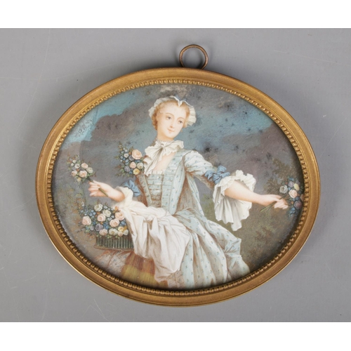 93 - A 19th century gilt framed painted ivory miniature, portrait of a flower girl. Bearing Latin excerpt... 