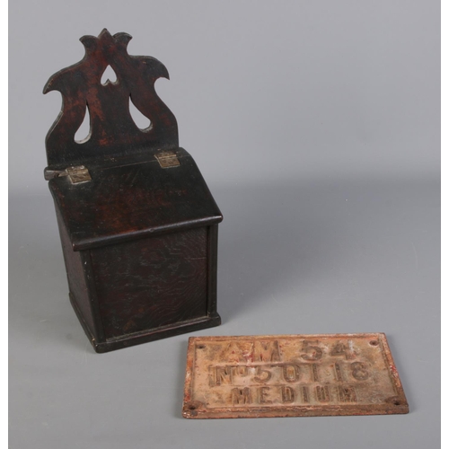 208 - A hinged oak salt/offertory box, together with a cast iron engineer plate.