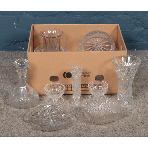 267 - A box of assorted cut glassware. To include vases, decanter, glasses and bowls etc.