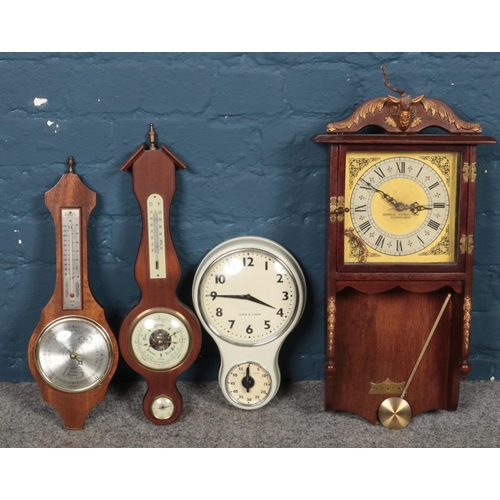 269 - Two quartz clocks, one with timer, together with two modern barometers, one produced by Shortland, M... 