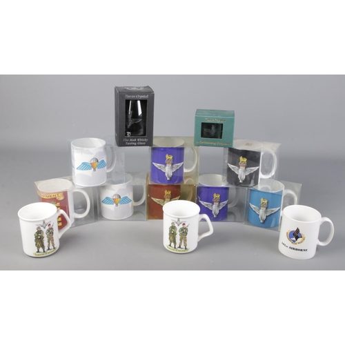 294 - A box of ceramic and crystal mugs with military insignias, mostly Parachute Regiment.