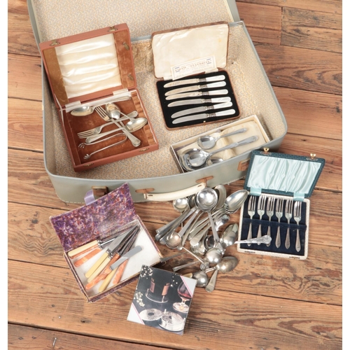 305 - A suitcase of mainly silver plated cutlery. Includes cased examples, mother of pearl tea knives etc.