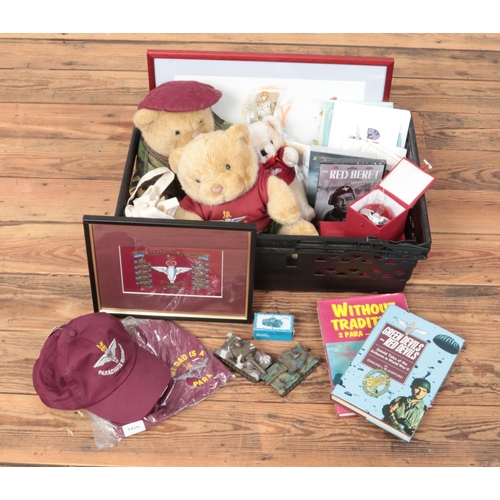 314 - A box of military collectables. Includes framed pictures, baubles, bears, baubles etc.