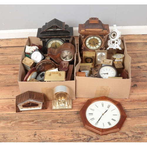 323 - Two boxes of clocks. Includes mantel clocks, quartz carriage clocks, wall clock etc.