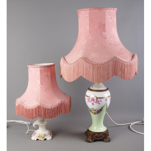 330 - Two ceramic table lamps, one with floral detailing, the other with a decorative metal base. Complete... 