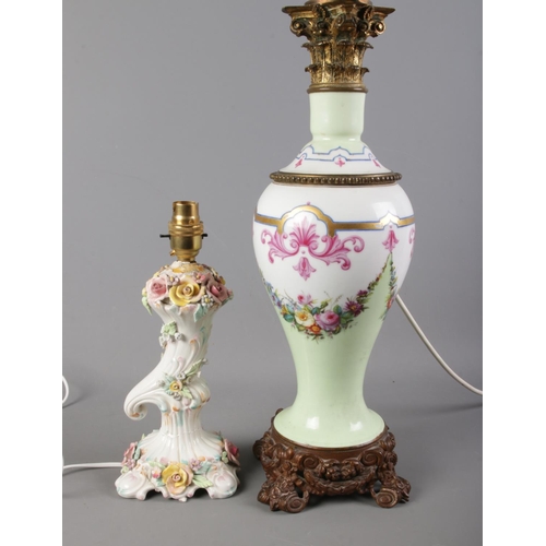 330 - Two ceramic table lamps, one with floral detailing, the other with a decorative metal base. Complete... 