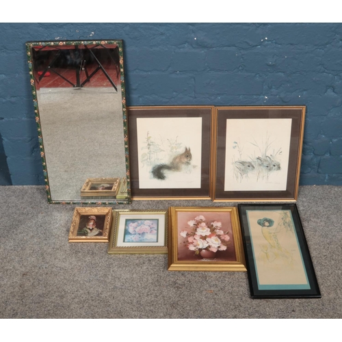 353 - A quantity of pictures, prints and mirrors. To include gilt framed oil on canvas study of flowers an... 