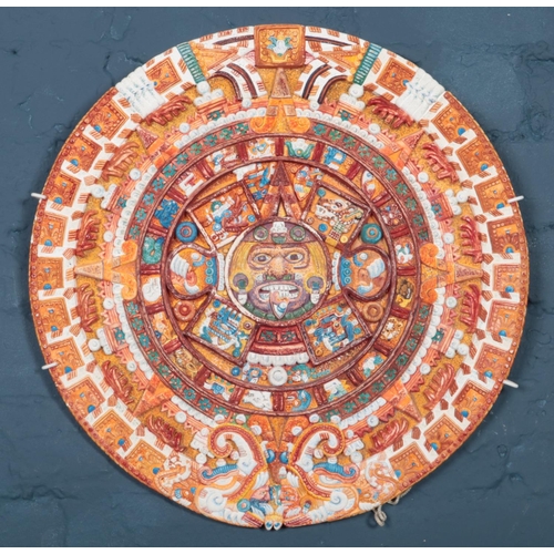 354 - A replica Aztec calendar plate featuring central face and two figures to the bottom. Diameter: 47cm.