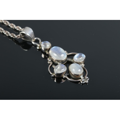 392 - A white metal moonstone pendant on sterling silver chain.