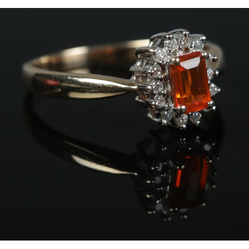 418 - A 9ct Gold, fire opal and diamond cluster ring. Size R. Total weight: 2.9g