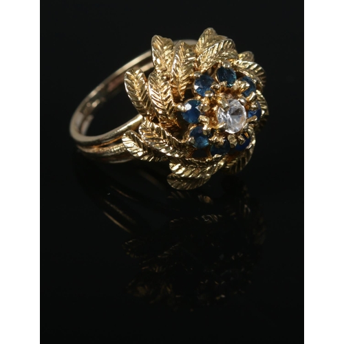 430 - A vintage 9ct Gold and Sapphire cluster floral cocktail ring. Assayed for London 1968. Size K½. Tota... 