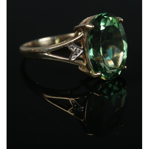 432 - A 9ct Gold, large green stone and diamond accent dress ring. Size P. Total weight: 3.7g.