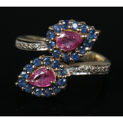 435 - A 9ct Gold sapphire, ruby and diamond crossover dress ring. Size N½. Total weight: 4.7g