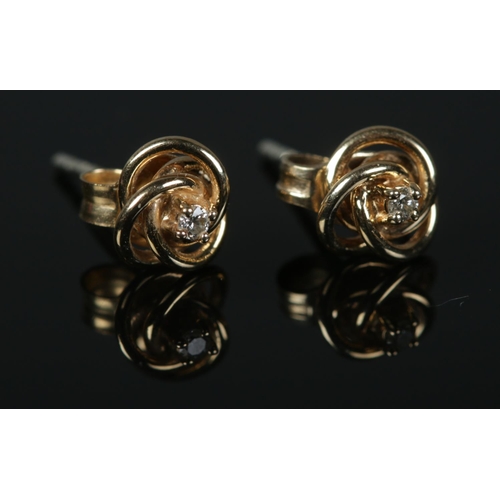 441 - A pair of 9ct Gold diamond stud earrings Total weight: 0.9g.