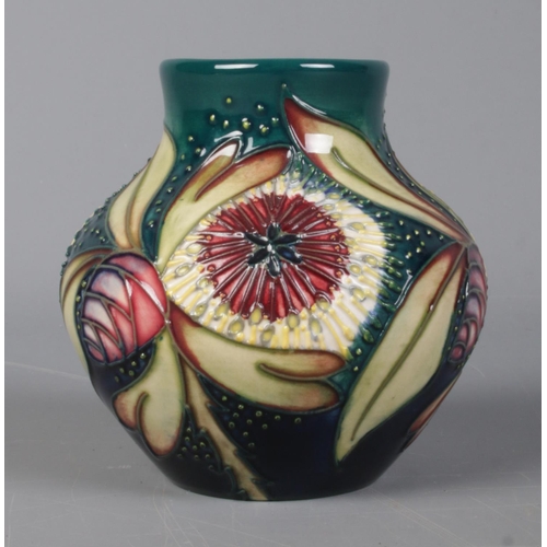 516 - A Moorcroft pottery vase of ovoid form, in the 'Albany' pattern. 8.5cm tall. Bares leaf mark to base... 