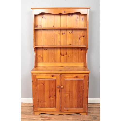 528 - A pine farmhouse style dresser, with lower drawers. Height: 172cm, Width: 89cm, Depth: 39cm.