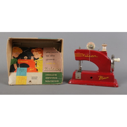 141 - A boxed Vulcan Minor child's sewing machine.