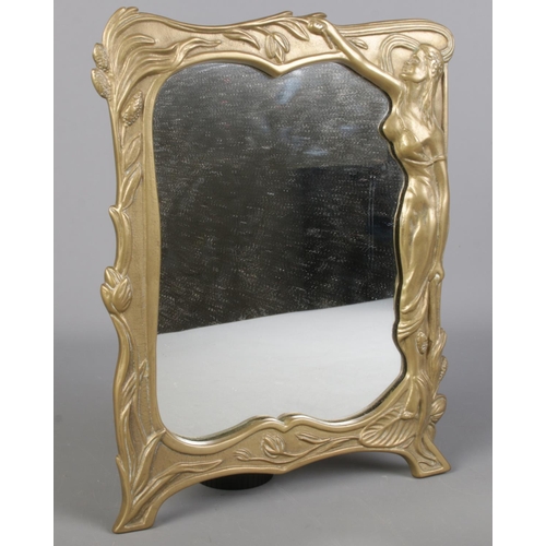 212 - A brass Art Nouveau style table mirror. (3cm x 25cm)