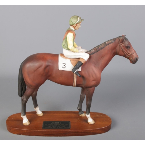 230 - A Beswick figure group of racehorse Nijinsky and jockey Lester Piggot. Raised on wooden plinth base.