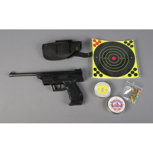 236 - A .177 caliber air pistol along with target and two tins of marksman pellets. CANNOT POST OVERSEAS