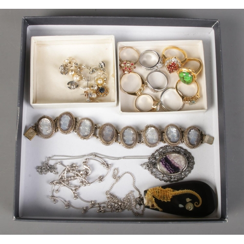 241 - A tray of costume jewellery. Including blue john pendant on chain, dress rings, earrings, etc.