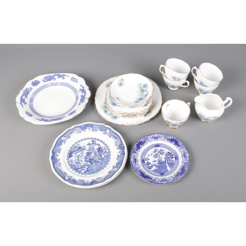 245 - A Colclough Nigella patterned tea service along with quantity of blue and white plates depicting ori... 