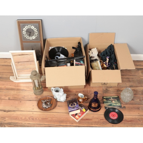 316 - Two boxes of miscellaneous to include novelty elephant teapots, toilet mirror, quartz wall clock, Cz... 